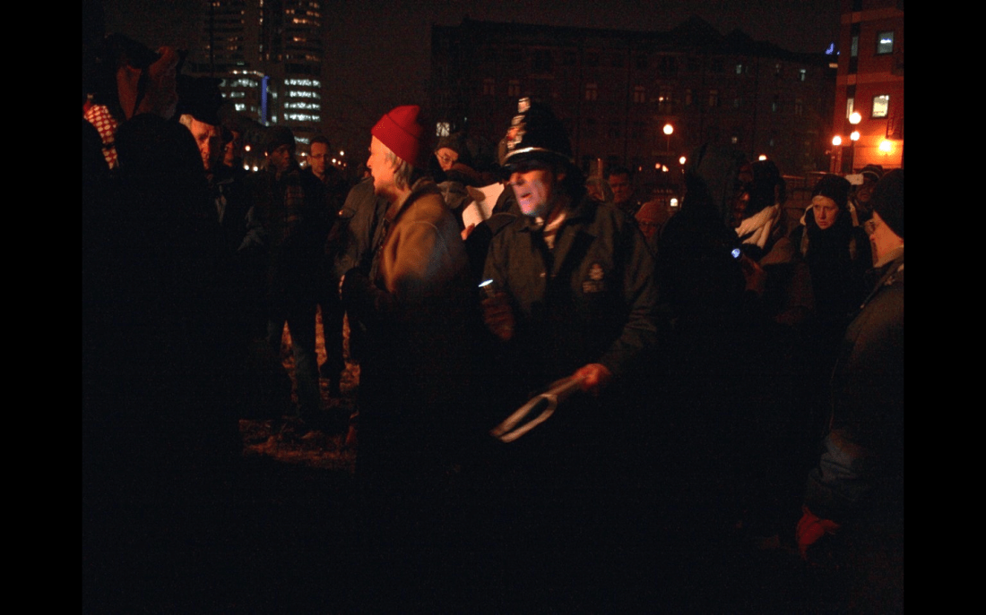 The Leeds Baggage Handlers, a mental health survivors’ writing group enacting scenes from David Oluwale’s life amongst the crowd.