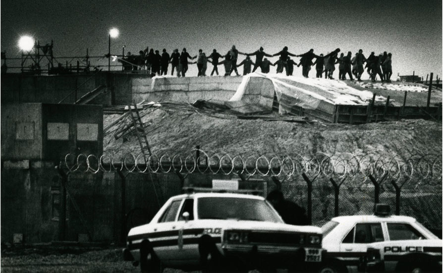 women dancing on top of the nuclear missile silos during a night time break in to the Greenham Common Nuclear Missile Base. (Provenance of photograph unestablished at time of posting - my apologies). 
